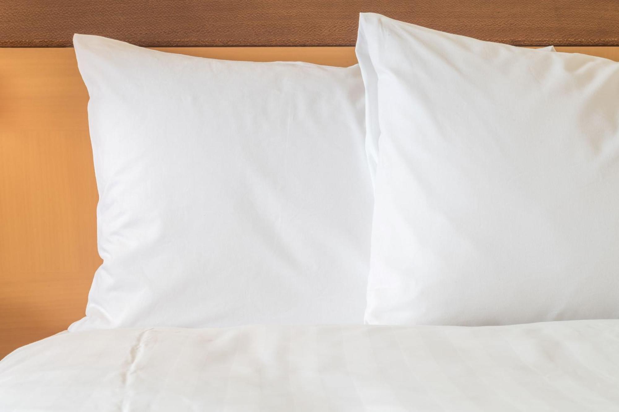 Intercontinental Residence Suites Dubai Festival City By Ihg Exteriér fotografie Two pillows on a bed